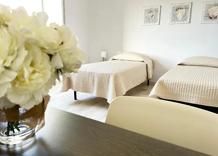 Domus Deledda アパート ポザーダ